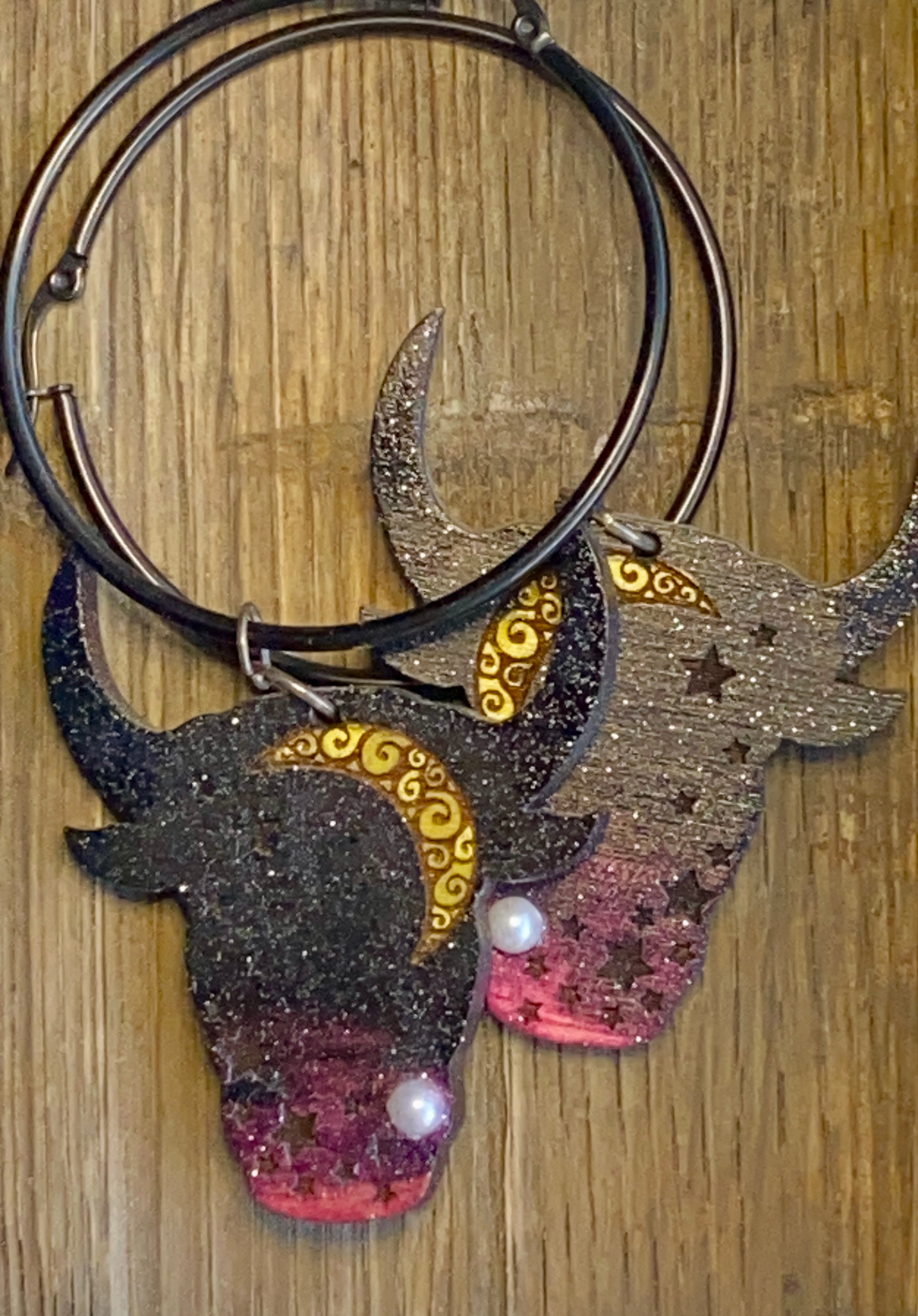 Cow Earrings wood background