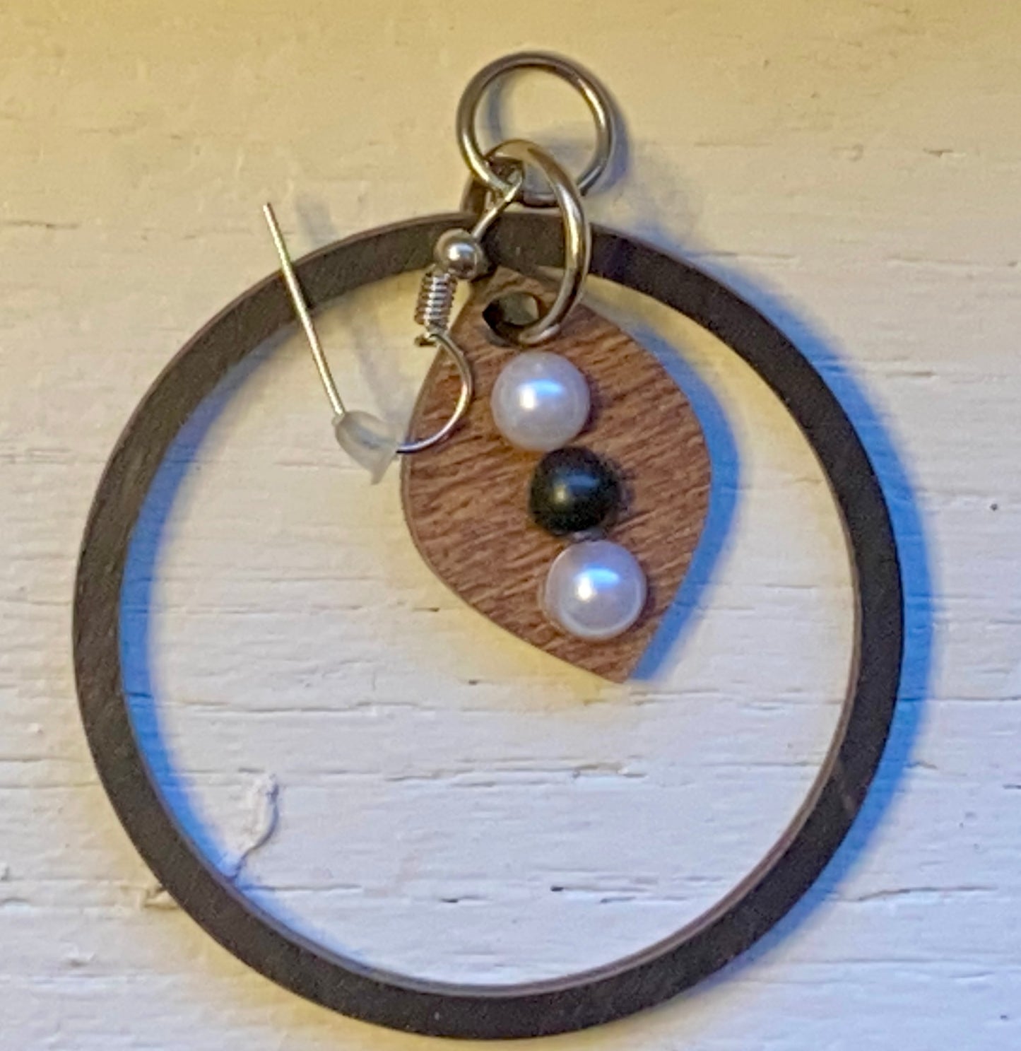 Black wooden circle earring with natural wood accent