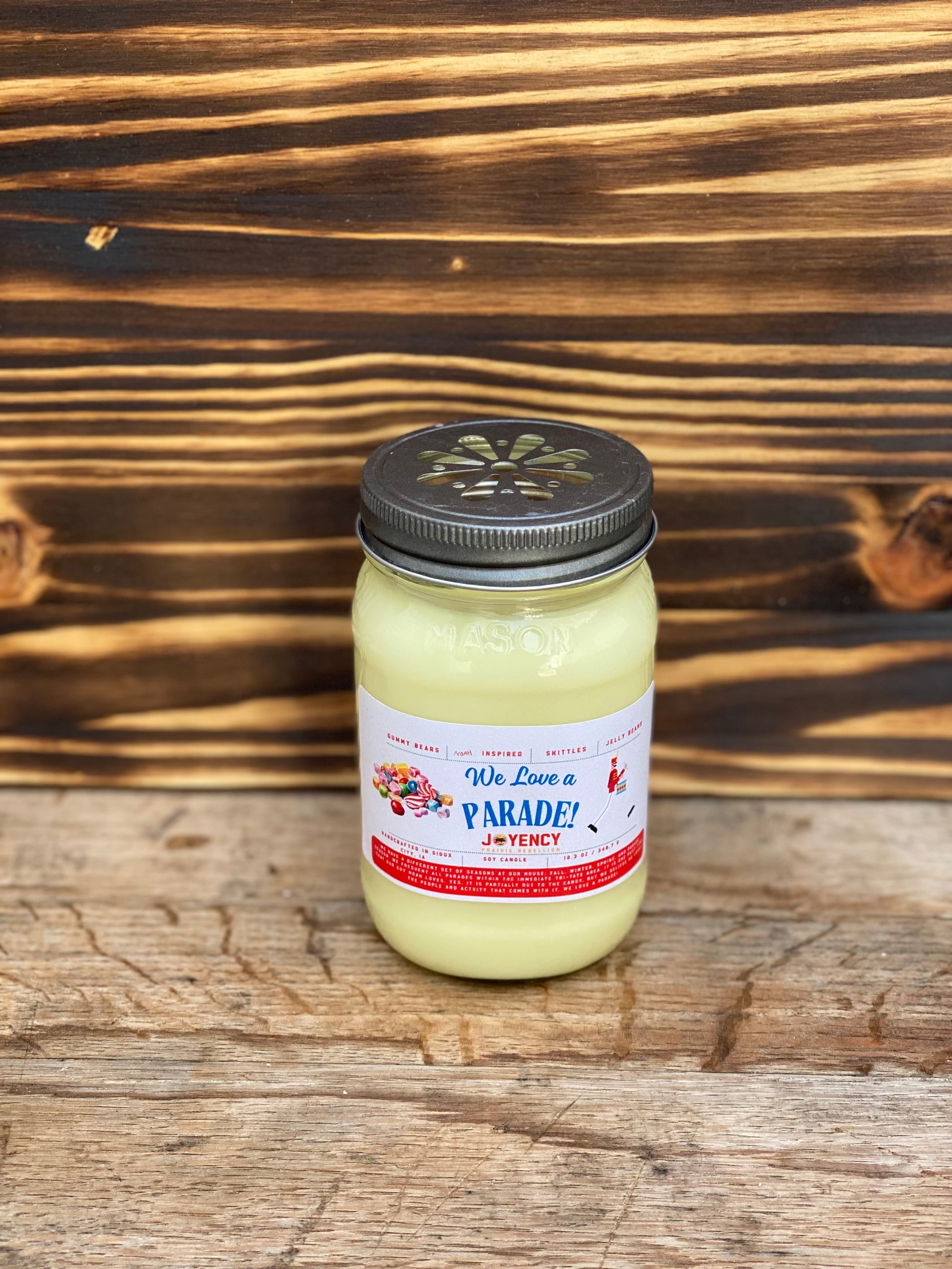 We Love A Parade hand-poured candle with gummy bears and candy background