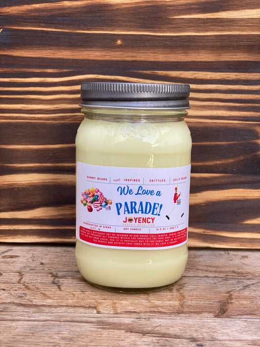 We Love A Parade hand-poured candle with gummy bears and candy background