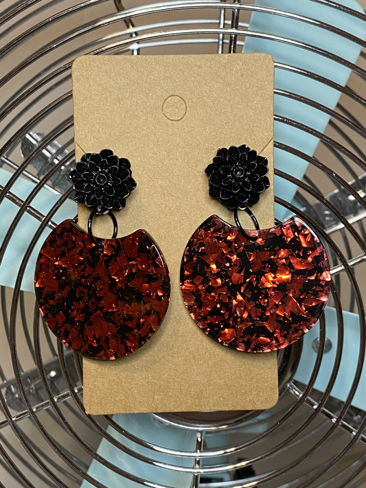 Black flower connector with red and black foil dangle