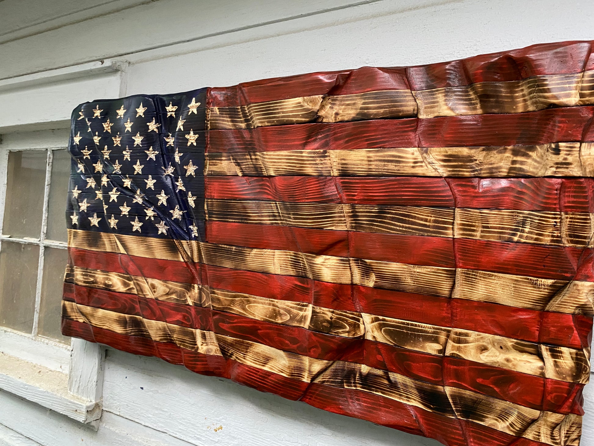 America waving wooden flag
